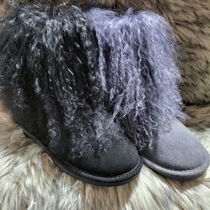 Women, black BearPaw Boo boots.